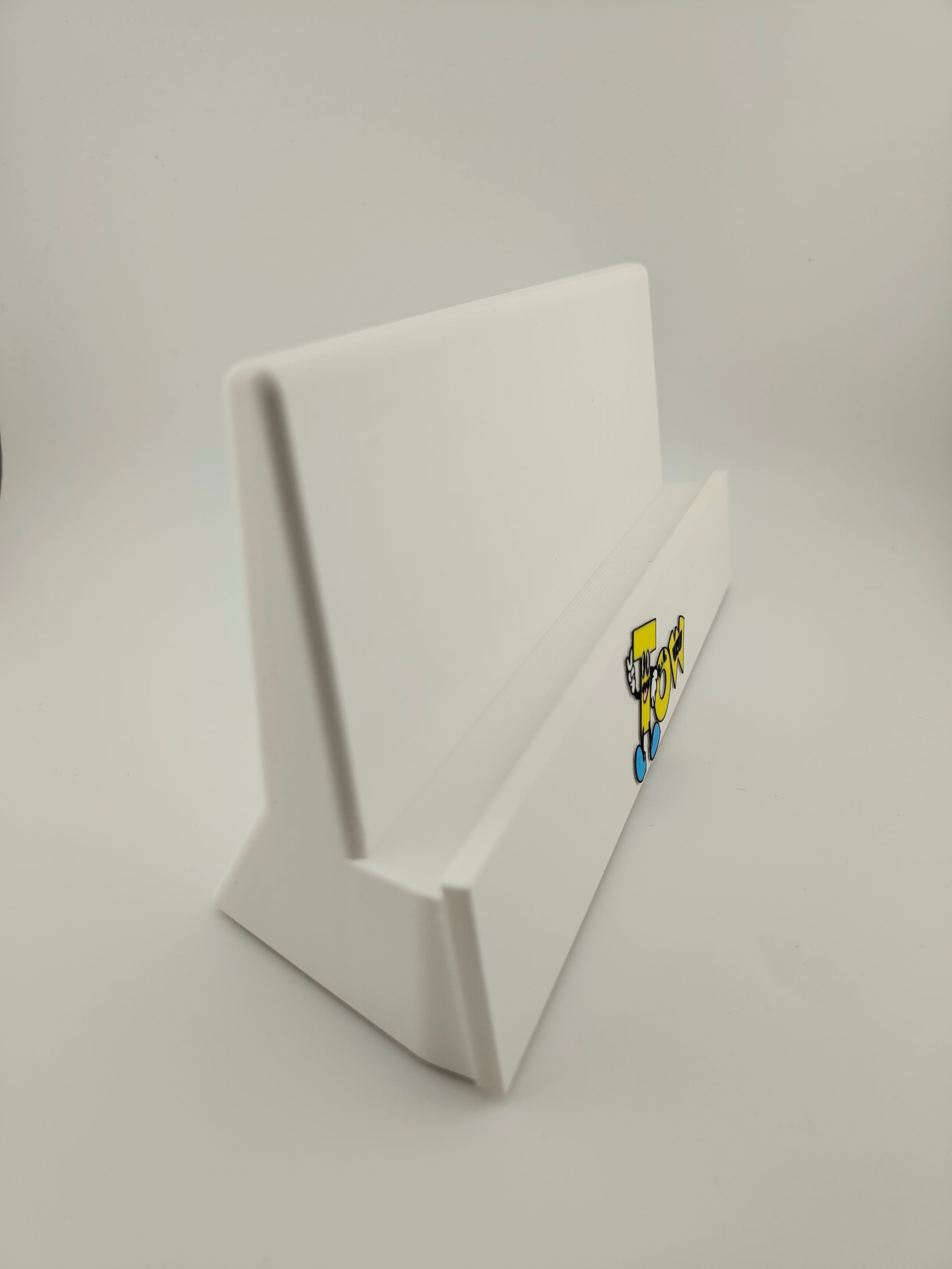 white trading card display stand with company logo