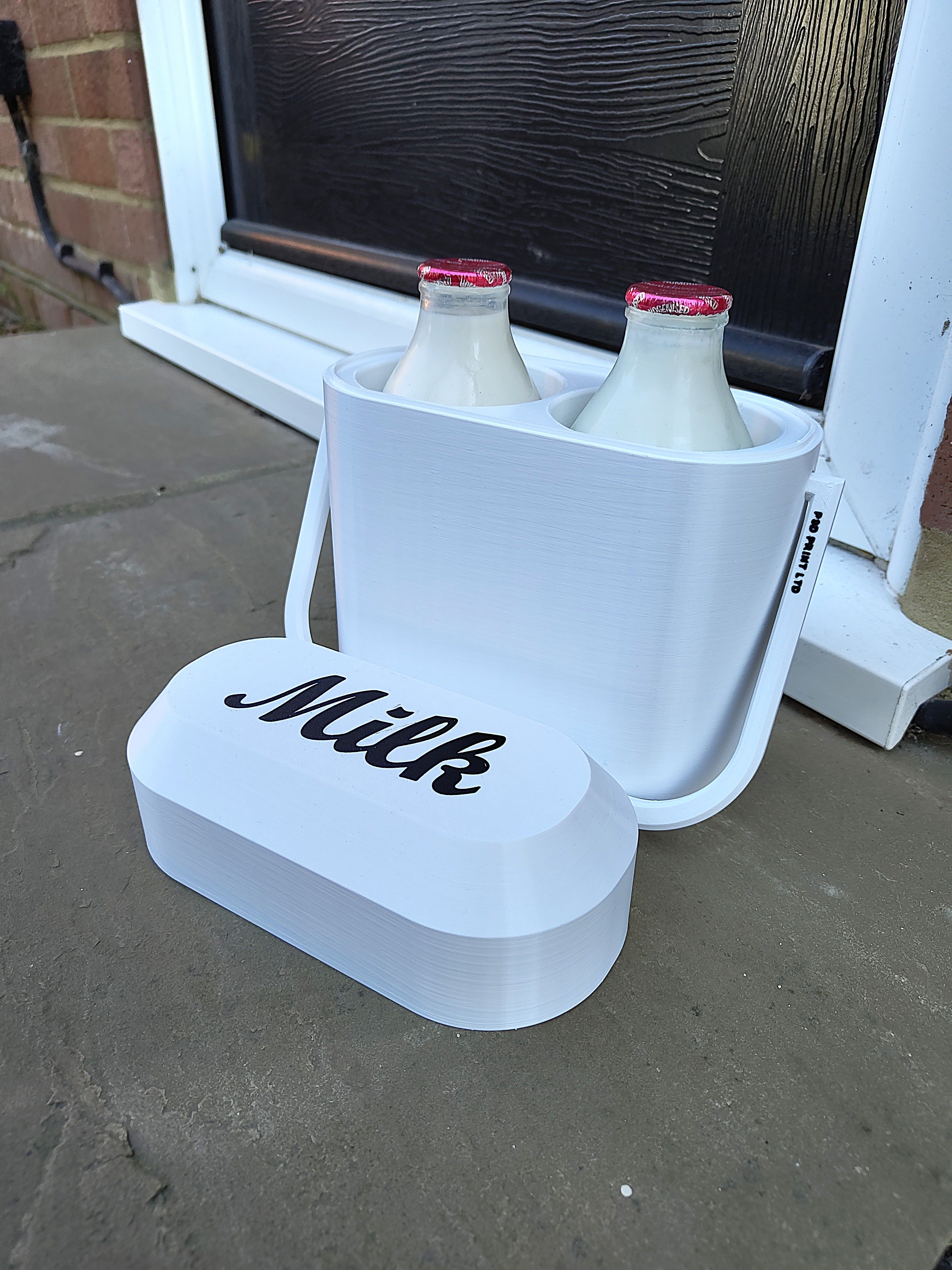 White milk crate with two bottles of milk on a concrete surface.